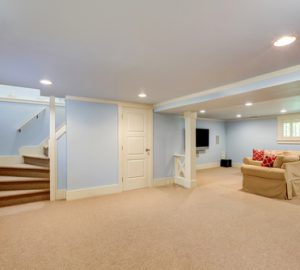 Spacious,basement,room,interior,in,pastel,blue,tones.,beige,carpet