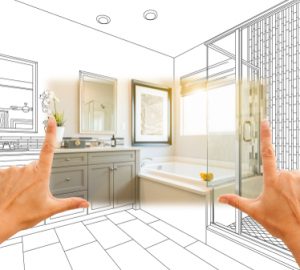 Hands,framing,custom,master,bathroom,photo,section,with,drawing,behind.