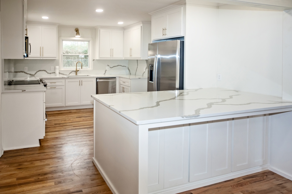 Light,and,bright,newly,remodeled,white,kitchen,with,quartz,countertops,