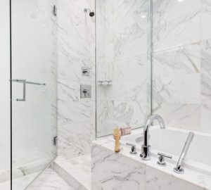Modern,luxury,bathroom,with,white,marble,tile,shower,enclosure,with